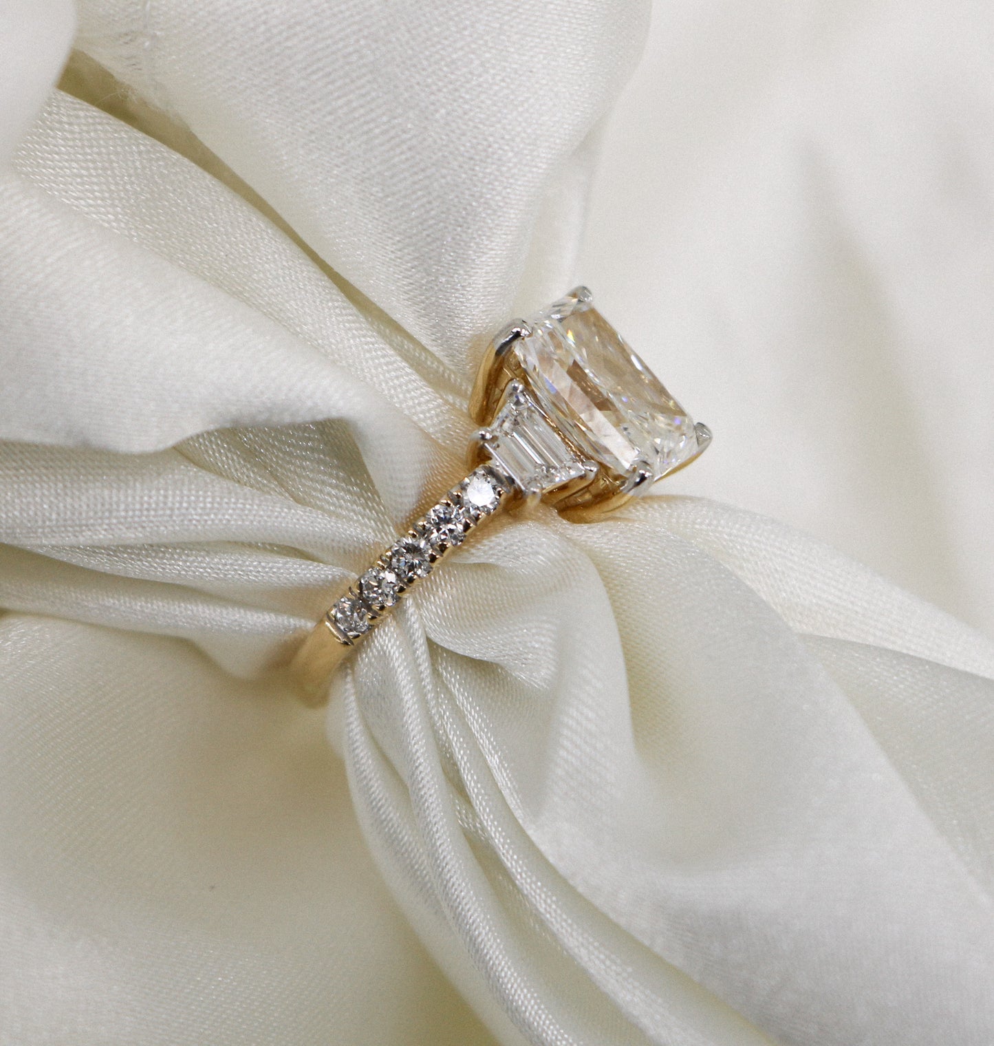 3.02 carat Radiant Lab Grown Diamond Center: 3-Stone in 18k Yellow Gold (VS1/E)